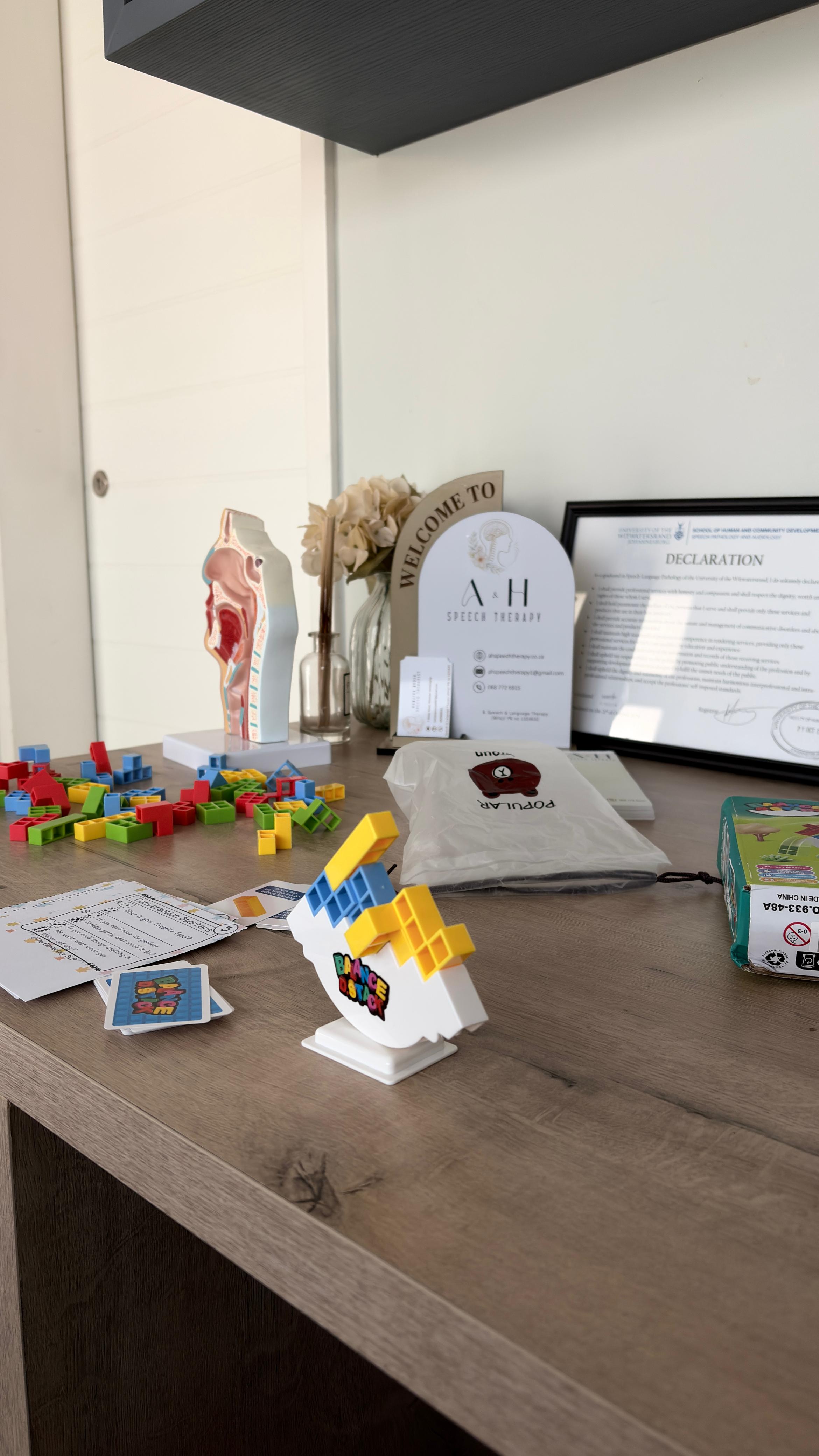 A&H Speech Therapy welcome display with games and session materials
